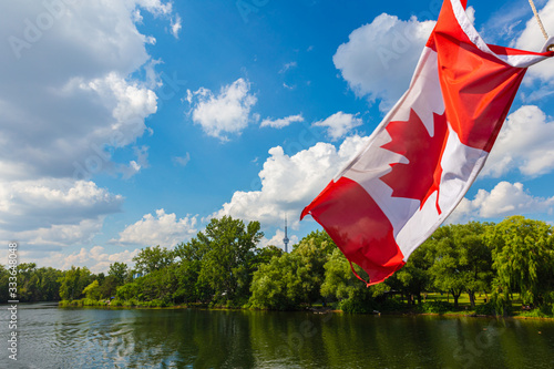 Photography Canadian flag on a cruise boat at the islands around the city of Toronto