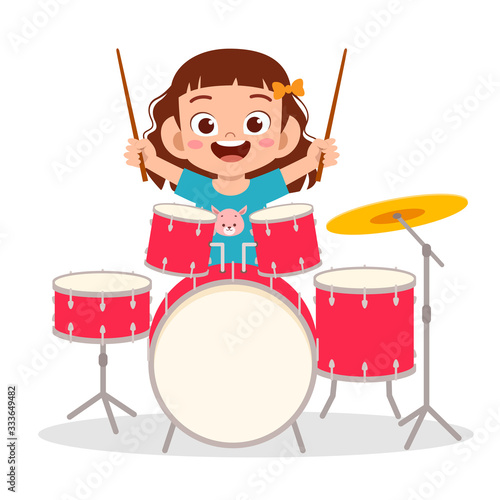 happy cute little kid boy playing drum