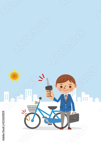 自転車にカギをかける男子学生(背景あり)