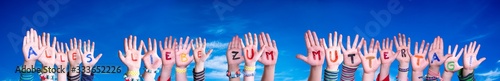 Children Hands Building Colorful German Word Alles Liebe Zum Muttertag Means Happy Mothers Day. Blue Sky As Background