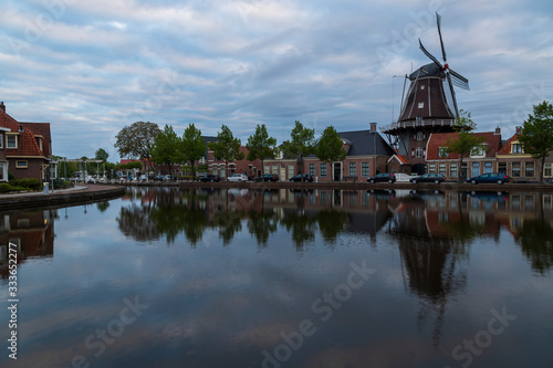 Water canal in Meppel, Holland at sunrise. The background is the sky with clouds.