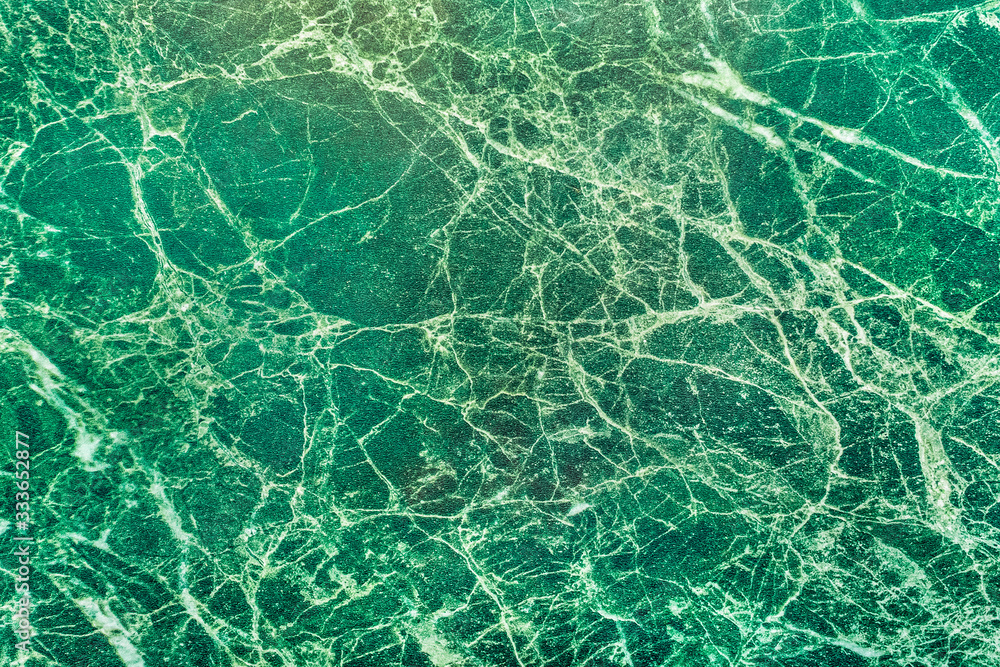 Green malachite surface texture with abstract pattern, background Green malachite surface texture with abstract pattern, background