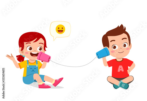 happy cute little kid boy and girl play toy phone