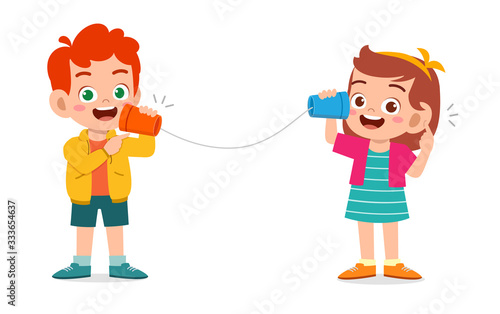 happy cute little kid boy and girl play toy phone