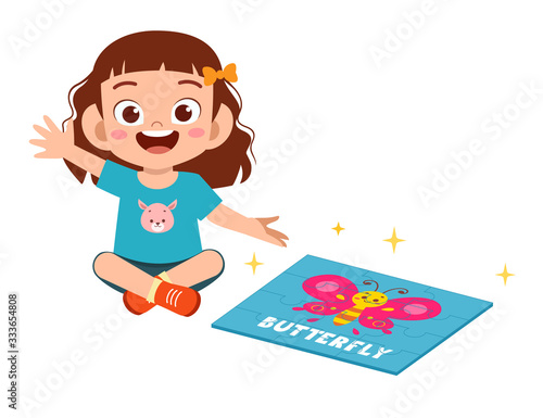 happy cute little kid girl play jigsaw puzzle