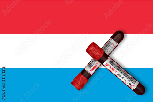 Test tubes with the Inscription 2019-nCoV on the background of the Luxembourg Flag. 3D Rendering