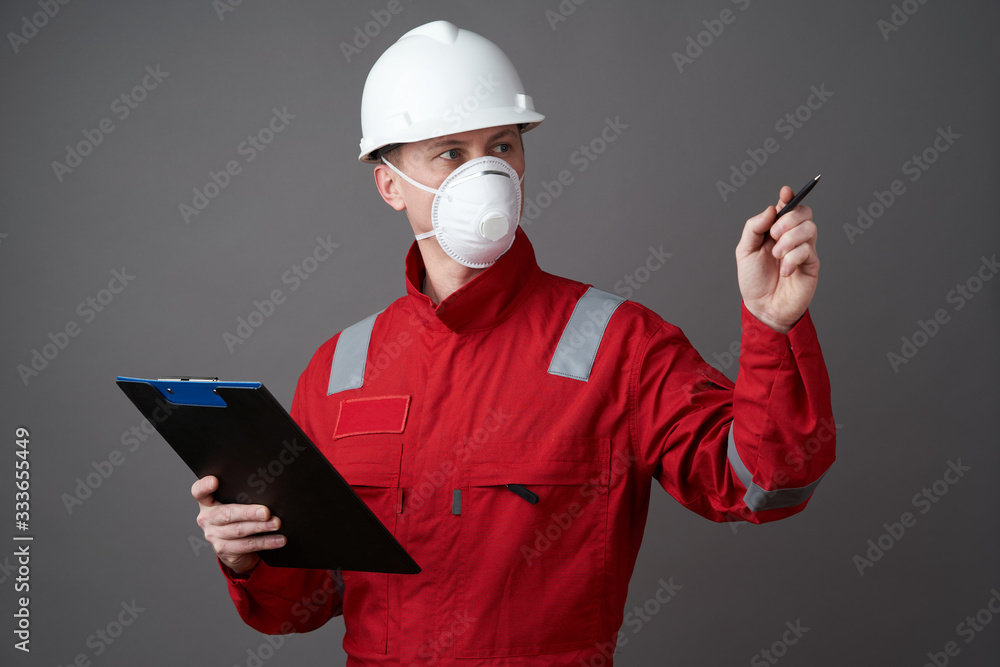 Man engineer, construction worker wearing face mask Man engineer, construction worker wearing face mask