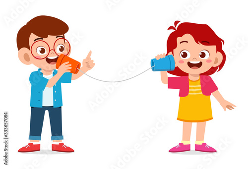 happy cute little kid boy and girl play toy phone