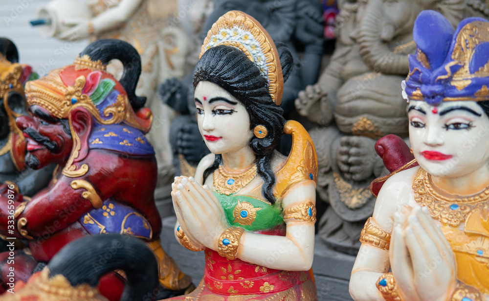 .statues of indonesian gods, hindu deities. Travel souvenirs in the form of statues of deities