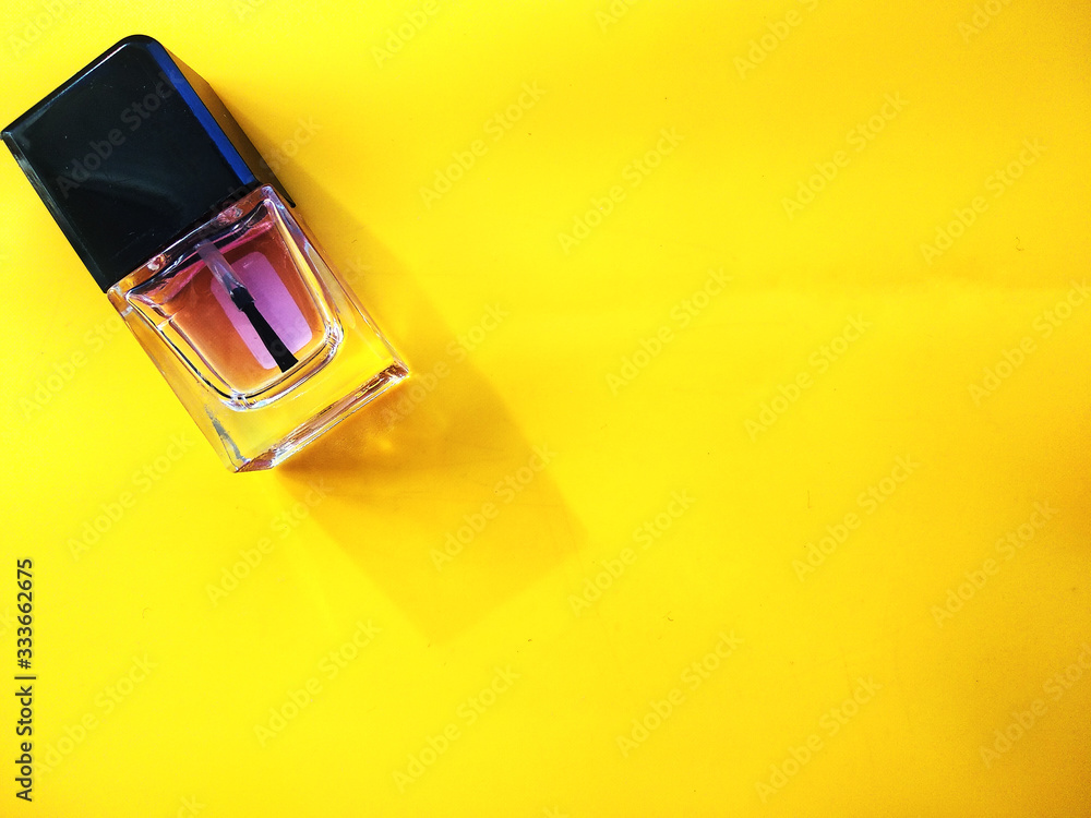 One nail polish on yellow background One nail polish on yellow background