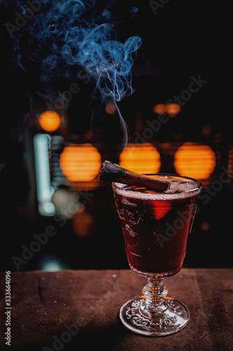 Red coctail with smoke cinnamon