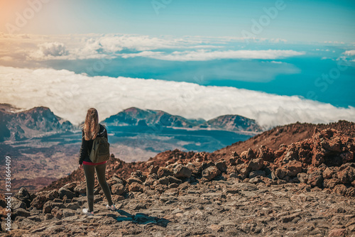 Young woman contemplating the entire Tenerife island from the top of the Teide Volcano © Ruben Chase