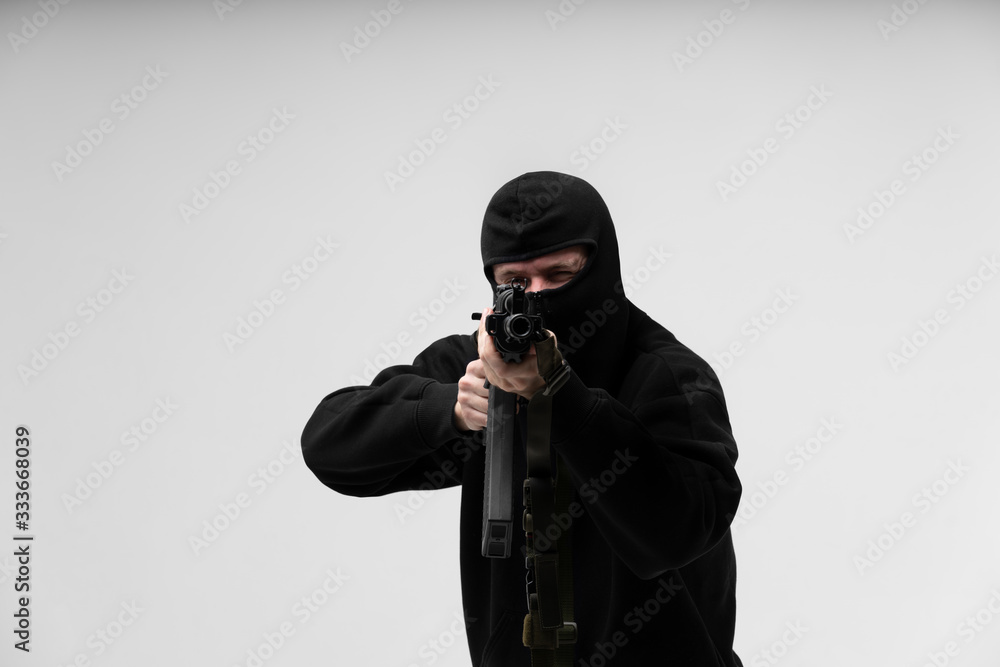 Man in mask With gun on white background