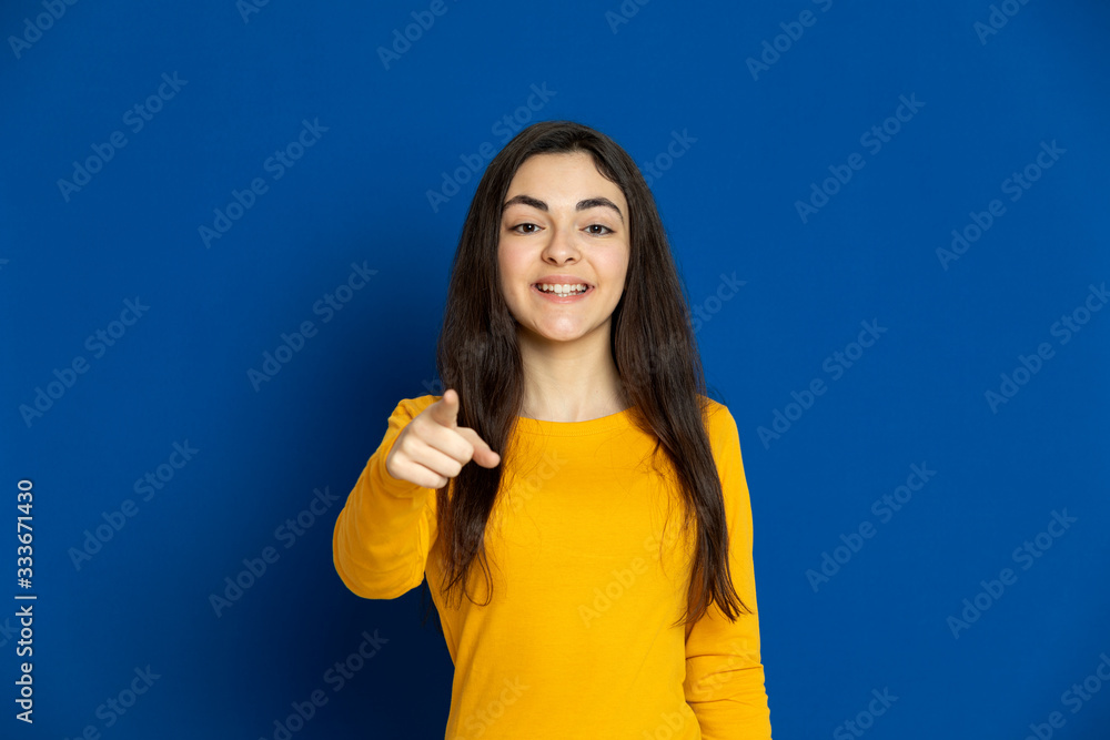 Brunette young girl wearing yellow jersey Brunette young girl wearing yellow jersey