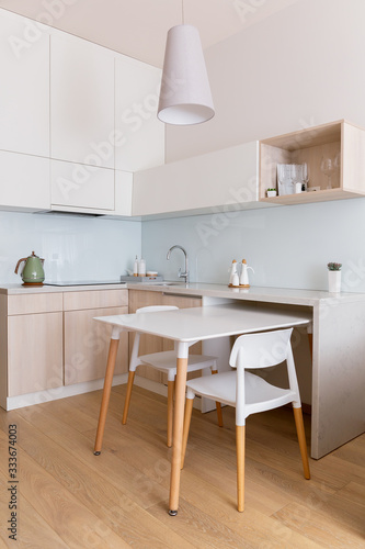 Sweet interior. Scandinavian-style kitchen in daylight. Vertical stories. © High Stock