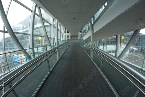 Empty aircraft walkway, inside bridge that headed to planes © Yurii Zushchyk