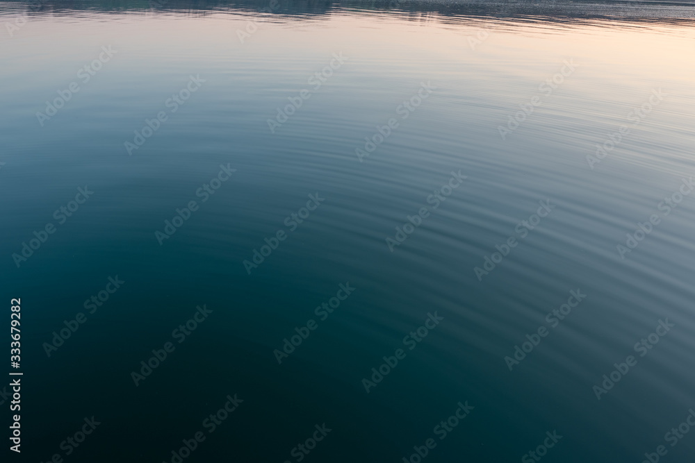 Fototapeta premium Photo of carm water at dusk in Wales 