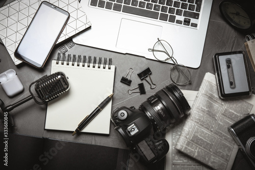 Flat lay composition with equipment for journalist on grey table