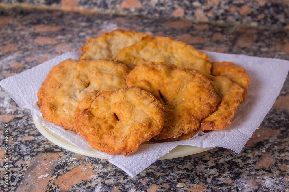 tray of freshly made fried cakes tray of freshly made fried cakes