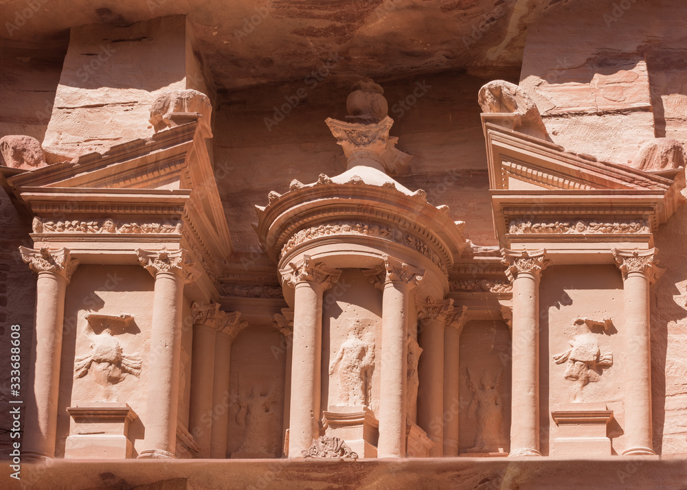 Fasade of the Treasury, a rock-cut temple in Petra, in historical and archaeological city in southern Jordan