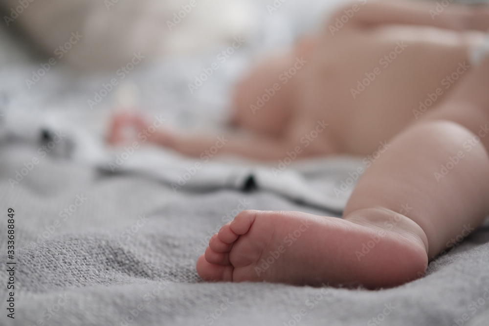 Top view wide angle sleeping baby lies in a crib arms and legs outstretched, baby sleep Top view wide angle sleeping baby lies in a crib arms and legs outstretched, baby sleep
