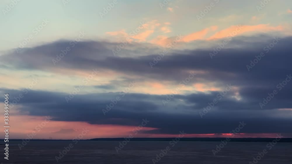 Beautiful view.Dramatic sunset. Moving cloudscape with beautiful sun . Fast moving dark blue, pink, red, orange clouds in the sky. Evening sky. Clouds natural background. Clouds 4k stock footages Beautiful view.Dramatic sunset. Moving cloudscape with beautiful sun . Fast moving dark blue, pink, red, orange clouds in the sky. Evening sky. Clouds natural background. Clouds 4k stock footages