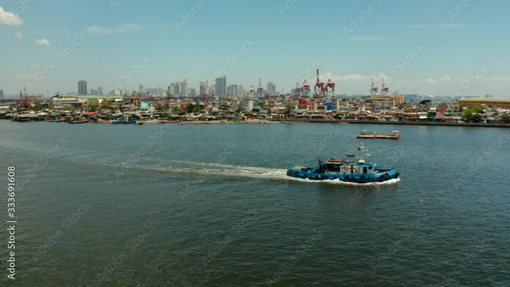 Cityscape of the capital of the Philippines Manila with the port and business centers, skyscrapers. Travel vacation concept Cityscape of the capital of the Philippines Manila with the port and business centers, skyscrapers. Travel vacation concept