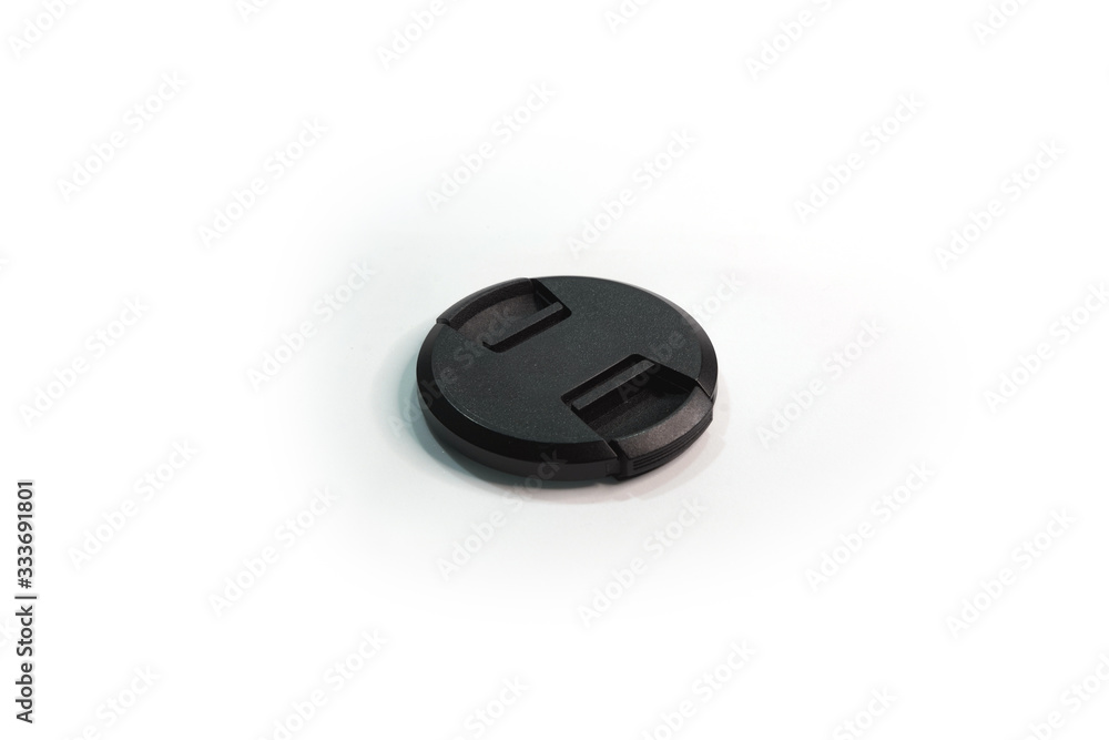 Black camera lens cover isolated on white. Lens front cover for the camera. Black camera lens cover isolated on white. Lens front cover for the camera.