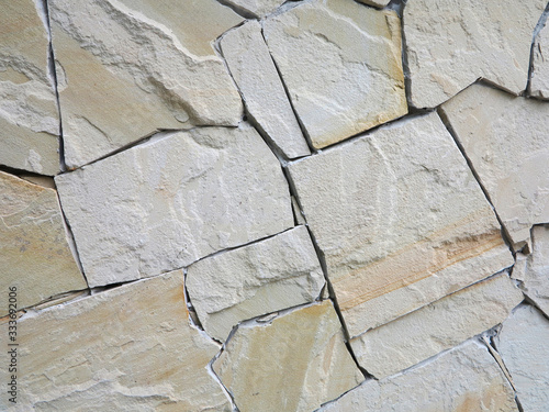  wall made of natural stone of different rocks 