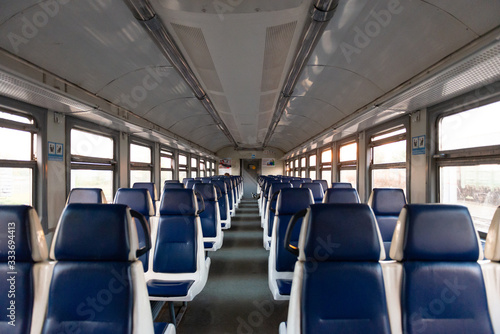 Electric train. An empty car of an intercity train. The train goes without passengers. Everything is quarantined.