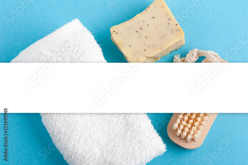 soap, white towel and wooden brush