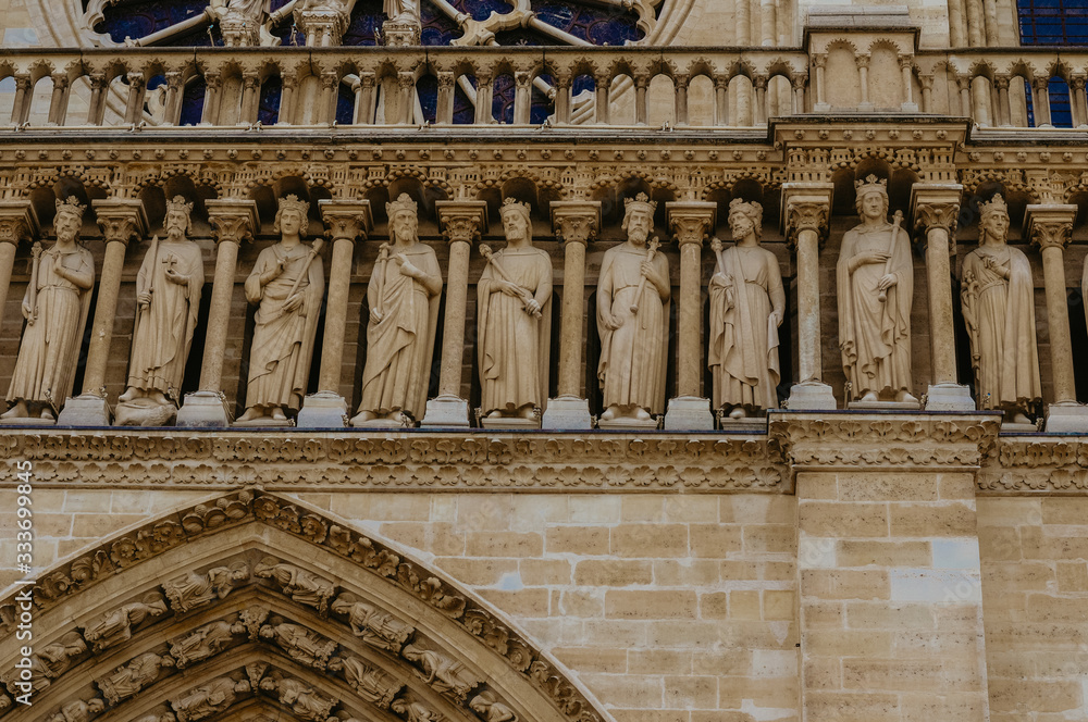Paris, France - June 1, 2012. Sculptures of saints in the exterior of Notre Dame de Paris Paris, France - June 1, 2012. Sculptures of saints in the exterior of Notre Dame de Paris