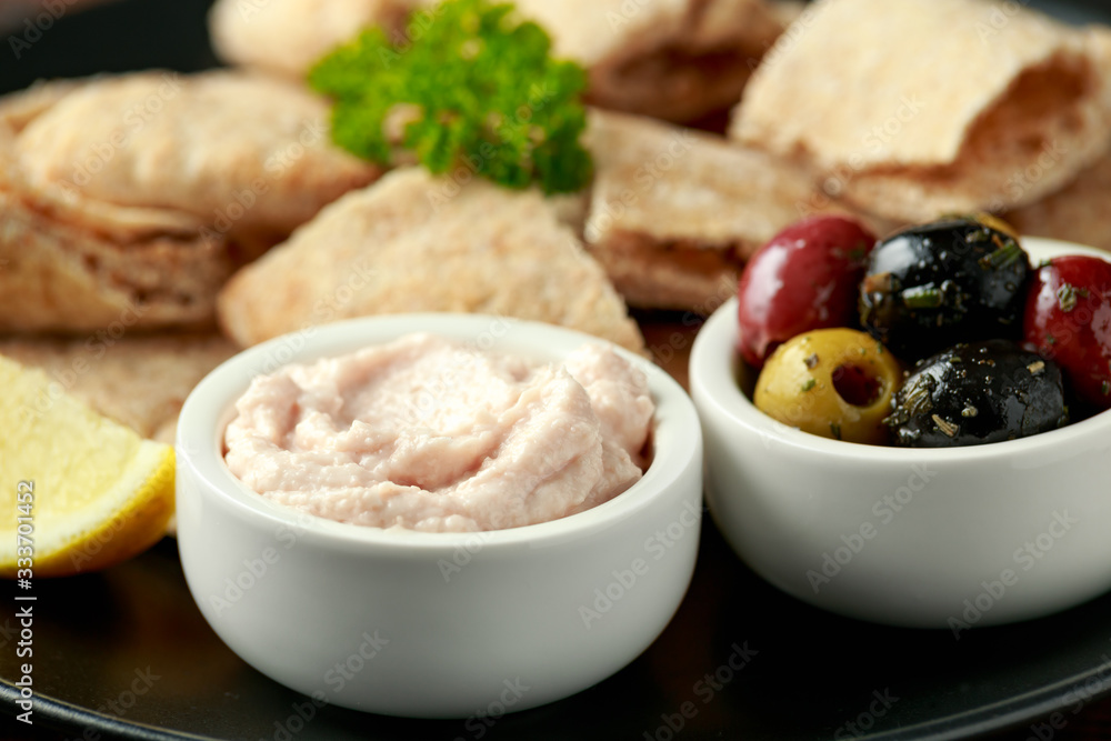 Taramasalata dip with pita bread and olives