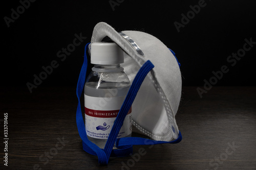 Surgical mask and a little bottle of disinfectant