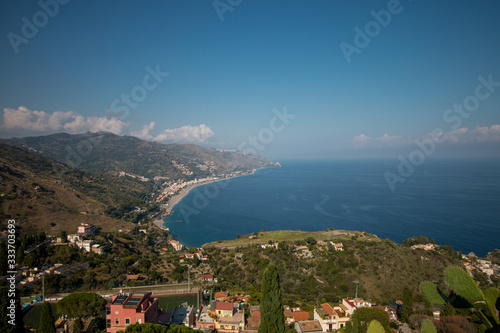 Beautiful landscape of Taormina  Italy. Sicilian seascape with beach and island Isola Bella. Travel photography.