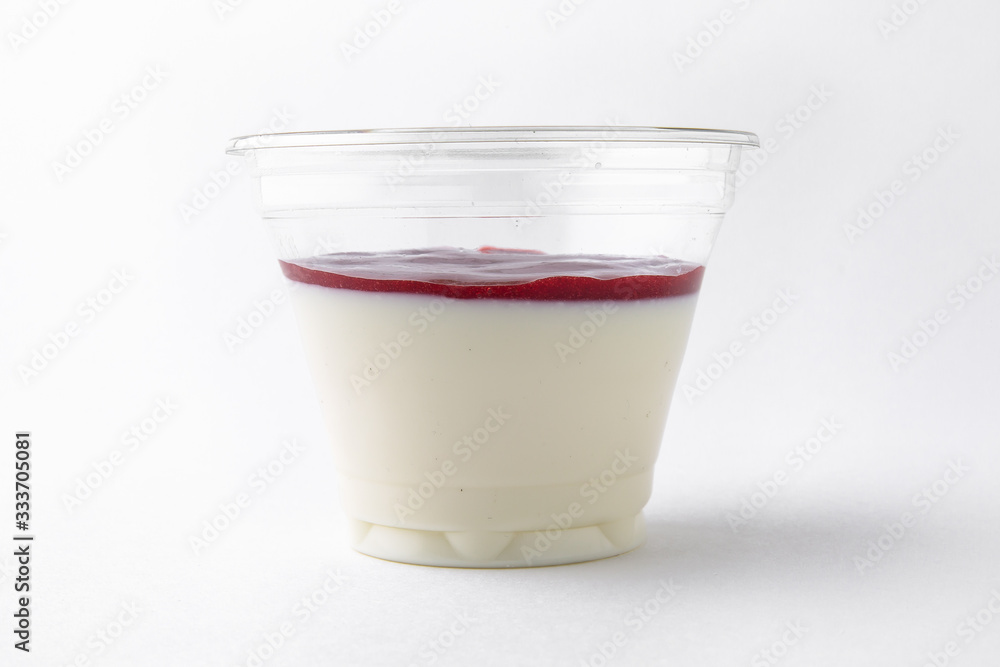 Dessert delicious pudding, panacota or jelly made from vanilla, jam and chocolate package in a plastic cup for take away or food delivery isolated on a white background. Dessert delicious pudding, panacota or jelly made from vanilla, jam and chocolate package in a plastic cup for take away or food delivery isolated on a white background.