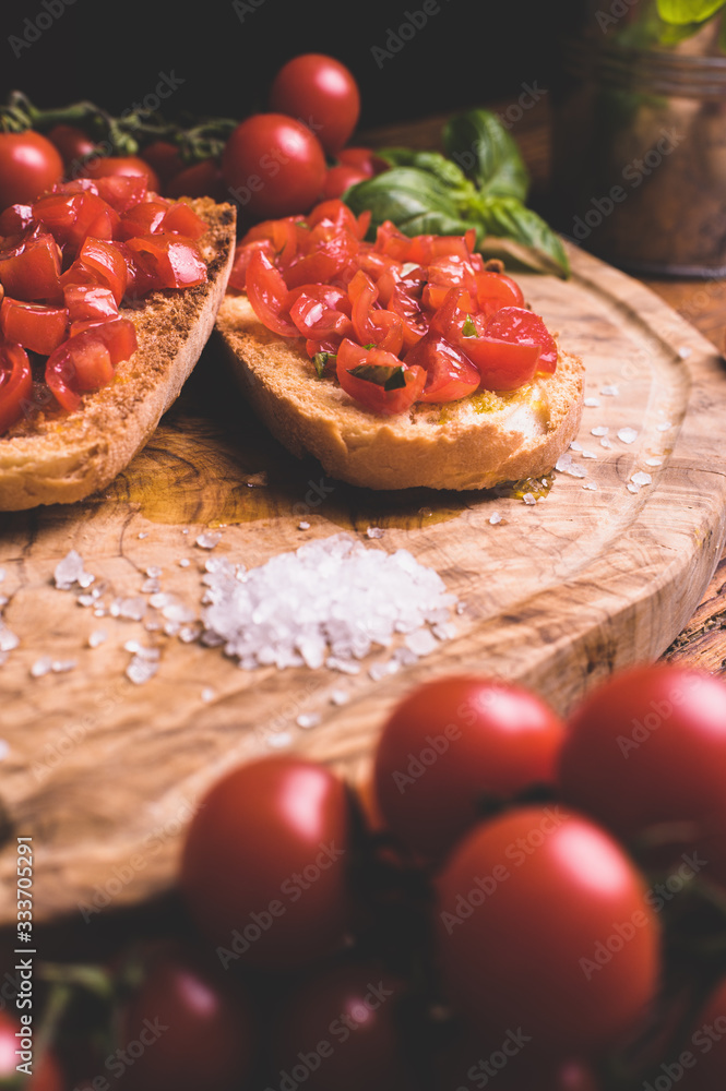 Italian bruschetta, toasted bred with fresh tomato and basil on woody vintage table Italian bruschetta, toasted bred with fresh tomato and basil on woody vintage table