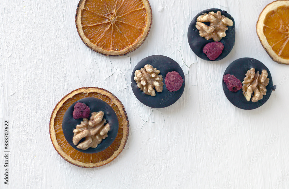 Mix nuts, dry fruits and chocolate rings on a white background Mix nuts, dry fruits and chocolate rings on a white background