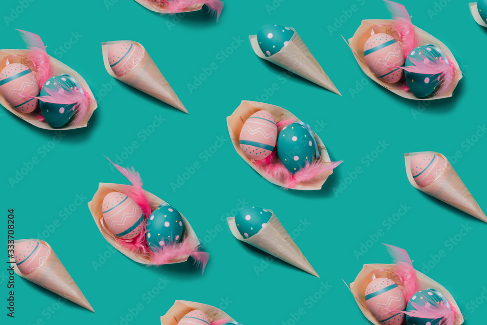 Naklejka premium Pattern with colored decorated eggs in bamboo cones look like ice cream and boat plates on green mint background. Concept of Easter, zero waste, ecology, copy space.