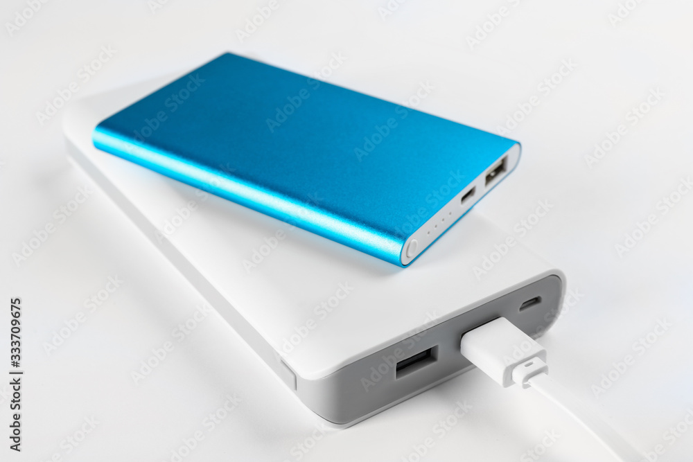Modern external portable chargers on white Modern external portable chargers on white