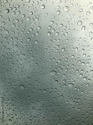 Water drop on the clear glass. fogged misted window with rain drops. Abstract background.
