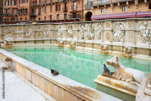 Fonte Gaia monumental fountain at the Piazza del Campo square in Siena city, Tuscany, Italy.  built in 1419