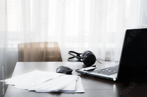 Quadro em tela Home workspace with laptop, computer mouse at telework due to quarantine of coronovirus pandemic COVID-2019