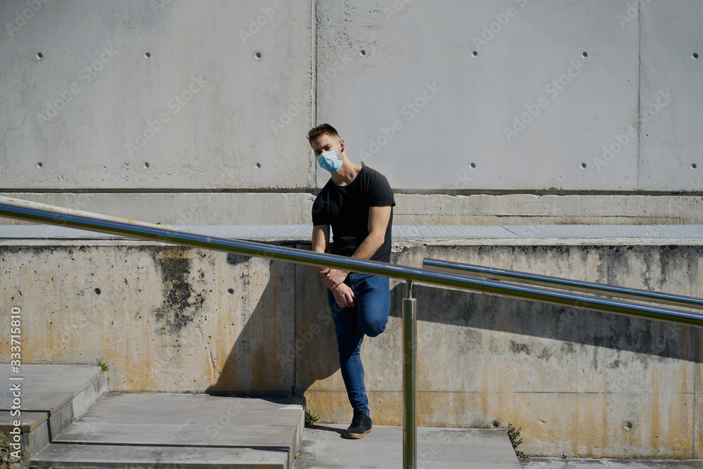 Caucasian male with medical masks as a defense against a virus. Coronavirus concept