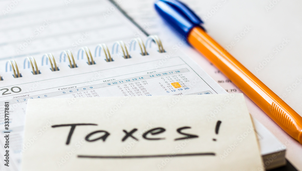 USA tax date marked on calendar close up, pen and notes, focus on planning number - 17 April USA tax date marked on calendar close up, pen and notes, focus on planning number - 17 April