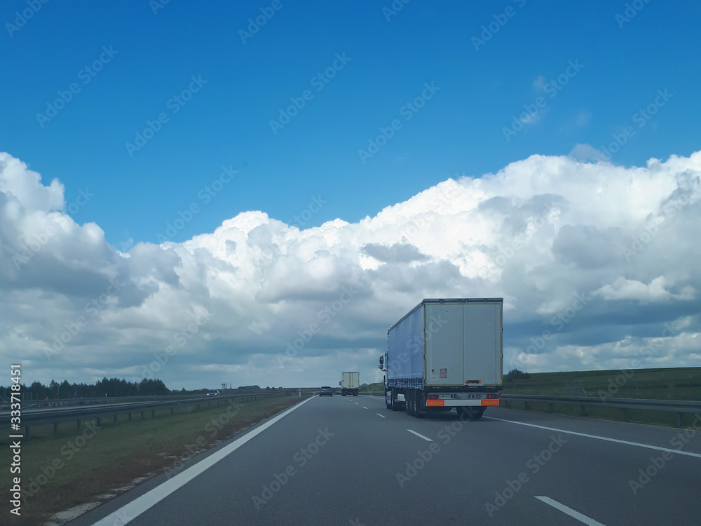 A truck driving on the highway in Poland. Transportation of heavy loads.