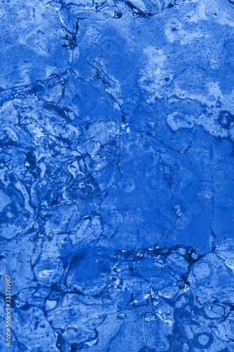 Abstract textured tinted classic blue color surface texture rough background, cement concrete floor or wall. Classic Blue trendy Color of the year 2020 - Image