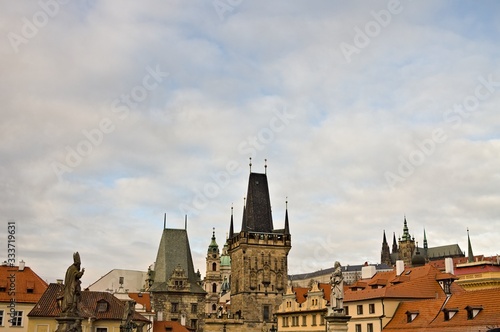 The Lesser Town Bridge Tower and the statues on the Charles Bridge (Prague, Czech Republic, Europe)