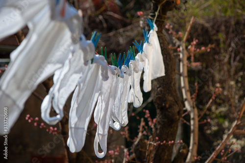 Underpants. Identical white underpants hung on the garden after the laundry. Same underwear dry outdoor.