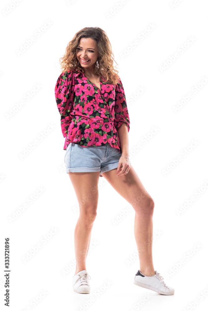 Young happy fashionable woman in stylish casual summer clothes smiling and relaxing. Full body isolated on white background. Young happy fashionable woman in stylish casual summer clothes smiling and relaxing. Full body isolated on white background.